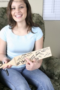 signing the paddle after being spanked